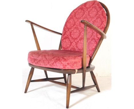 Lucian Ercolani for Ercol - Windsor Model - A retro vintage 20th Century beech and elm easy / lounge chair / armchair having 