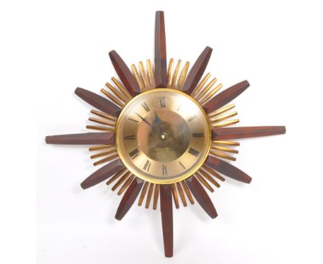 British Modern Design - Mid century Acctim starburst wall clock. Champagne dial with roman numeral chapter ring, all within a