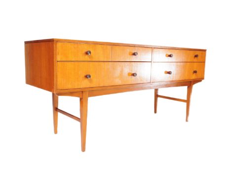 A retro vintage mid 20th century teak veneered sideboard. Of rectangular form with a bank of four shorts drawers atop two hal