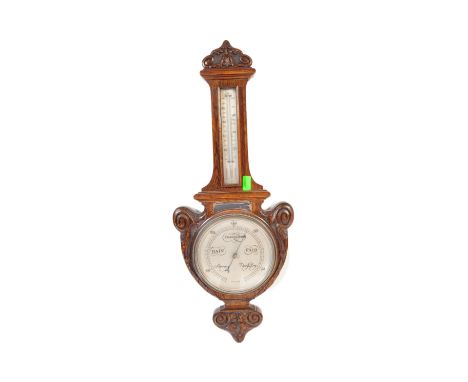 Early 20th century large oak aneroid wall barometer - thermometer banjo shaped compendium. Carved oak top with milk glass lin