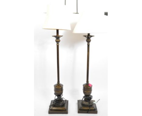 A pair of vintage 20th century Hollywood Regency metal desk table lamps lights having a cream conical shade over a pineapple 