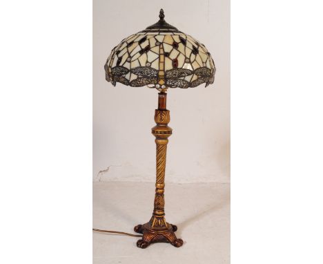 A contemporary Tiffany style glass table light - lamp and shade. The leaded and coloured glass ovoid shade&nbsp; having a dra