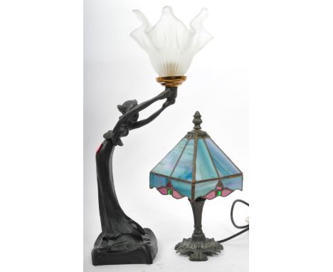 A vintage 20th century Art Nouveau Tiffany style table lamp having stained glass and leaded shade with in blue and purple wit