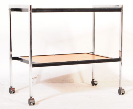 British Modern Design - A mid century retro butlers - hostess serving trolley. Raised on castors having chrome upright frame 