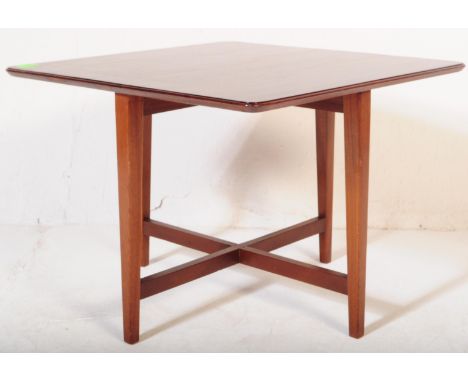 A retro vintage mid 20th century dark teak coffee table in a Danish / Scandinavian manner. Of square form having a rounded ed