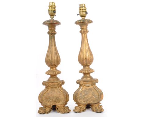 A pair of early 20th Century circa. 1900's solid wooden wood lamp stands. Fully carved body detailing on solid wood circular 