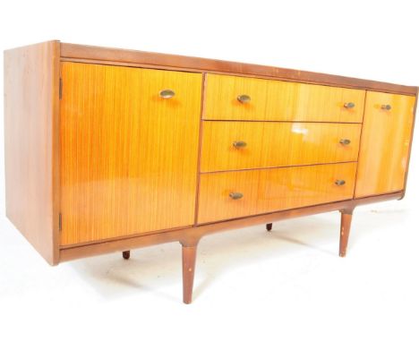 F Wrighton &amp; Sons Ltd, Walthamstow, London. A vintage mid 20th century teak wood sideboard credenza by Wrighton. Having a