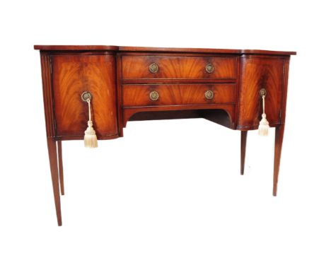 A George III line inlaid flame mahogany reproduction sideboard dresser in the George III style. Rectangular form with shaped 