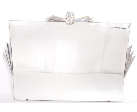 A 1930's Art Deco frameless bevelled edge Odeon star burst wall - overmantel mirror.&nbsp; Frameless angular design set with 