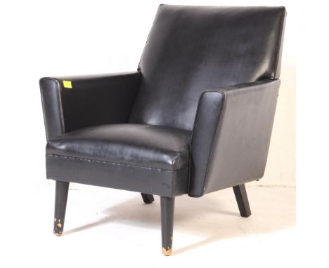 A retro, vintage 1970's full black vinyl, arm chair having slender shaped arm rests over a black vinyl removable seat raised 