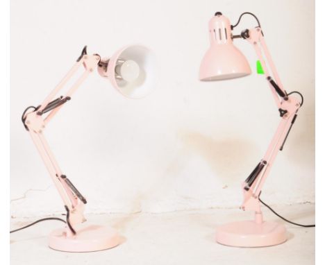 A pair of contemporary angle poise style table desk light lamps. Having a conical shade with twin ebonised spring loaded arms