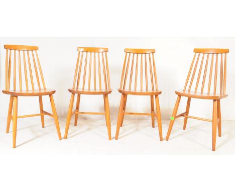 A set of four retro 20th century beech &amp; elm in the manner of Ercol, Continental Czech spindle back dining chairs raised 