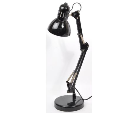 A retro vintage 20th century black angle poise table top desk lamp. The lamp having conical shade over articulated arms on a 