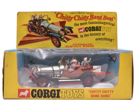 A Corgi Toys Chitty Chitty Bang Bang (266). 1st series 1967, with all original figures and both front and rear wings. Boxed w
