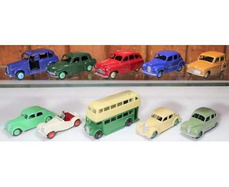 10 well restored Dinky Toys. Austin Devon and Austin Taxi, both in dark blue. Austin Devon in light green, Hillman Minx in da