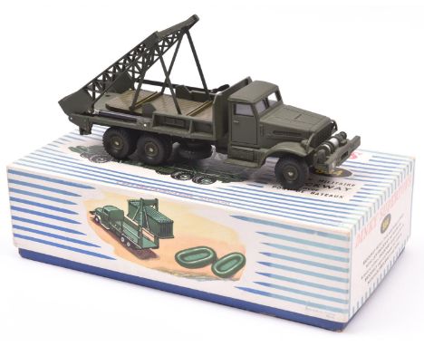 A French Dinky Supertoys Brockway Military Truck with bridge of boats (884). Boxed, with bridges and 2 boats. Minor/some wear