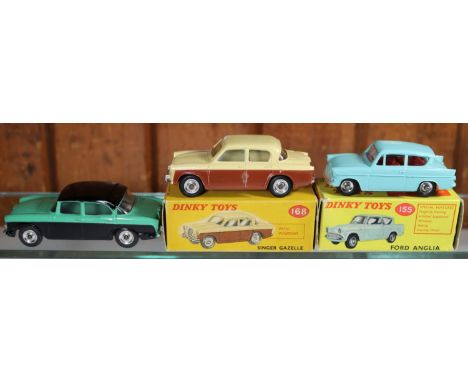 3 Dinky Toys. Ford Anglia (155) in turquoise with red interior. A Singer Gazelle (168) in cream and dark brown. Both boxed, s
