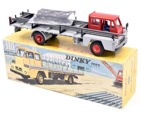 French Dinky Toys Camion Saviem Porte-Fer (885). Red cab with light grey body and red plastic wheels, with a steel red load a