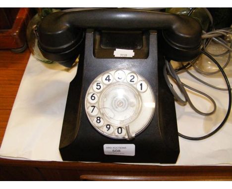 A vintage black Bakelite telephone 