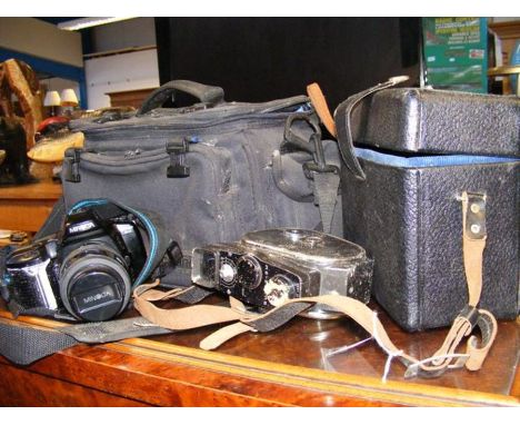 A vintage cine camera, together with other photographic equipment 