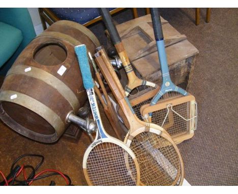 Assorted vintage tennis rackets, a beer keg and a churn 