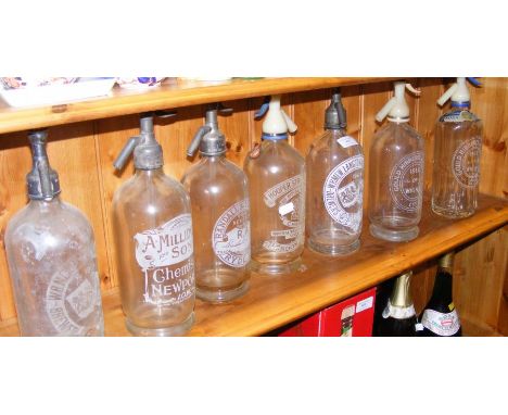 A collection of seven vintage Isle of Wight soda siphons 