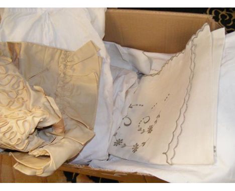 A collection of vintage embroidery and clothing 
