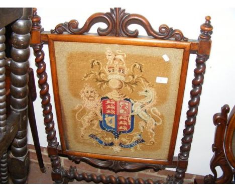 A Victorian fire screen with tapestry panel 