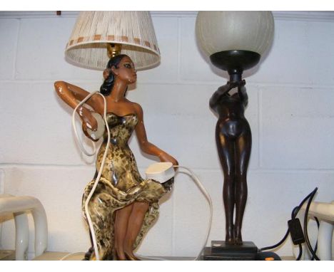 A vintage style table lamp together with one other