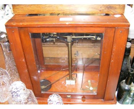 A pair of cased laboratory scales 