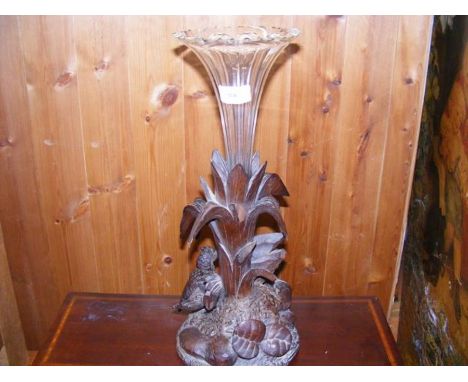 A carved wooden epergne with trumpet glass vase 