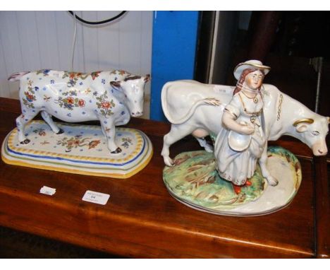A Quimper ornament of a Bull, together with a Staffordshire ditto CONDITION REPORTDAMAGE AND LOSS AS PER IMAGES