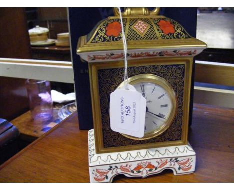 A boxed Royal Crown Derby clock standing 18cms highCONDITION REPORTgood condition, no visible signs of damage or repairneeds 