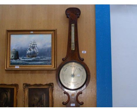 A Victorian walnut wheel barometer/thermometer by Casartilli of Liverpool