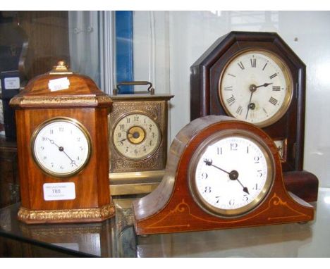 A continental mantel clock, together with three other mantel clocks 