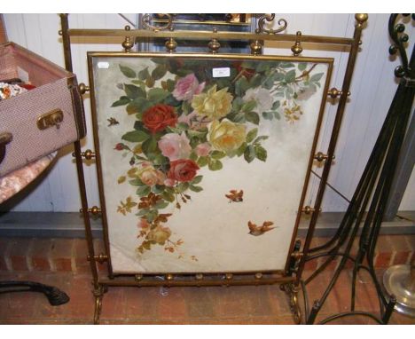 A Victorian brass fire screen