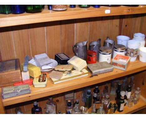 A shelf of various collectables including commemorative beaker, Senior Service tobacco tin etc.