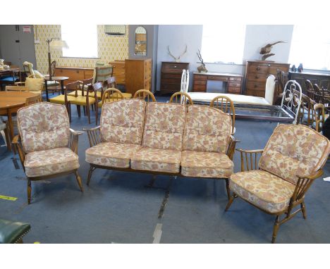 Ercol Three Piece Suite Comprising Three Seat Sofa and Two Armchairs (some faults to the webbing)