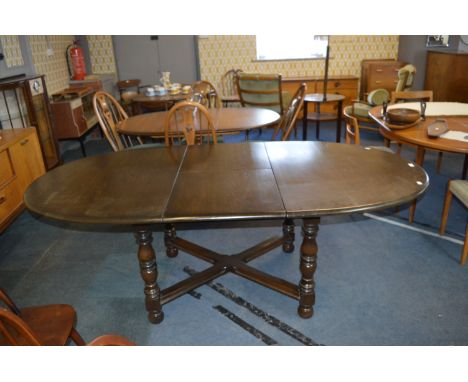 Ercol Dark Oak Oval Extending Dining Table 