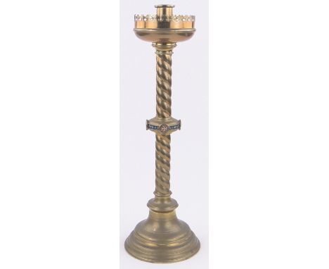 A large 19th century brass Gothic style church candlestick,with a central band of enamel decoration, height 24".