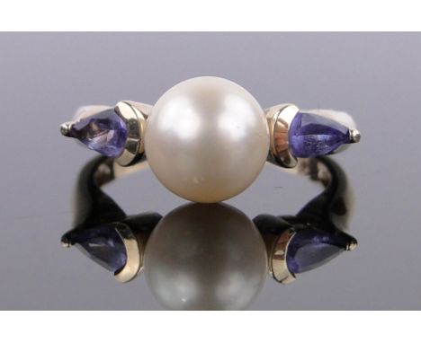 A 9ct gold 3 stone tanzanite and pearl ring,setting width 20mm, size K