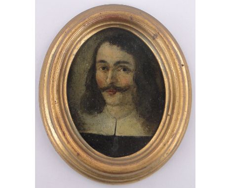 An 18th/19th century miniature oil on metal,portrait of a man wearing a lace collar, unsigned, moulded giltwood frame, overal