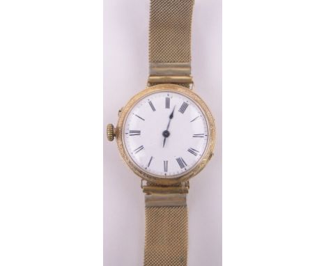 A Swiss 19th century 18ct gold cased pocket watch converted to a wristwatch,with engraved case, enamel dial on later gold pla