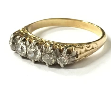 A yellow metal five stone diamond ring (size K 1/2).