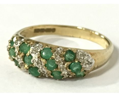 A 9 carat gold emerald and diamond set ring (size N).