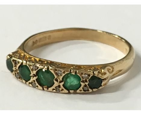 A 9 carat gold emerald and diamond set ring (size N 1/2).
(R3)