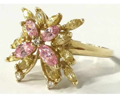 A 14 carat gold butterfly ring set with yellow, pink and white stones (size T).
(R13)