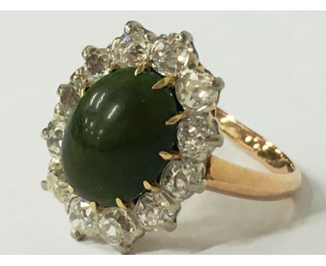 A Victorian turquoise and diamond cluster ring (one diamond replaced), (size M).