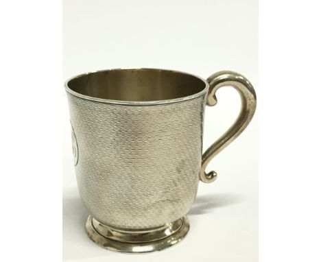 A Victorian engine turned silver Christening mug (153 grams).