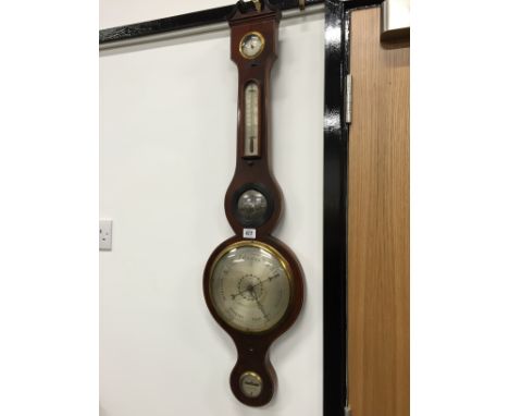 A 19th century mahogany line inlaid wheel barometer by Sisini, London.